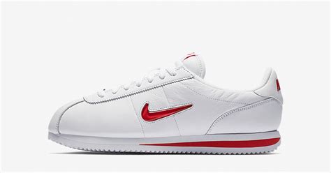 white Nike with red swoosh